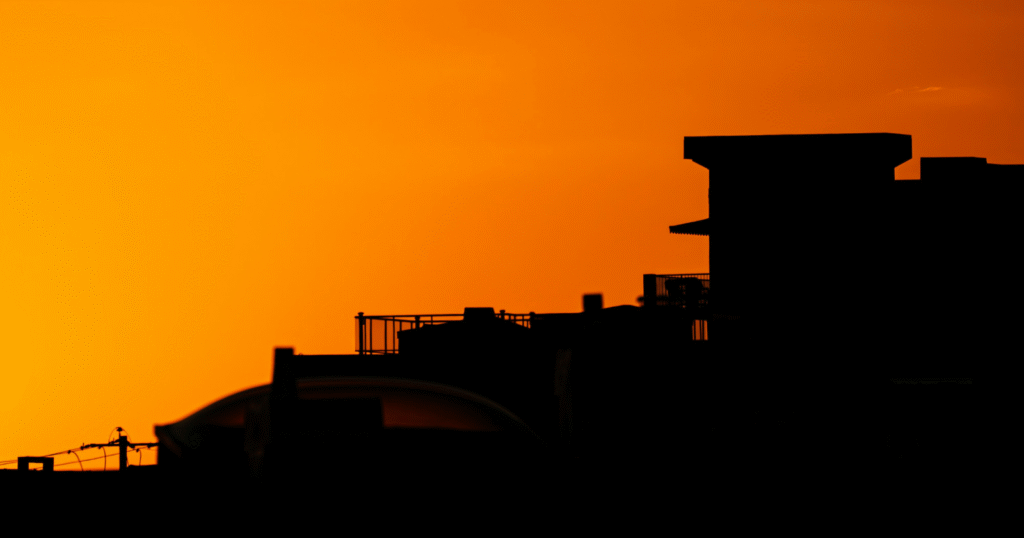 Photographer capturing stunning photos during golden hour using a DSLR for the best camera shoot.
