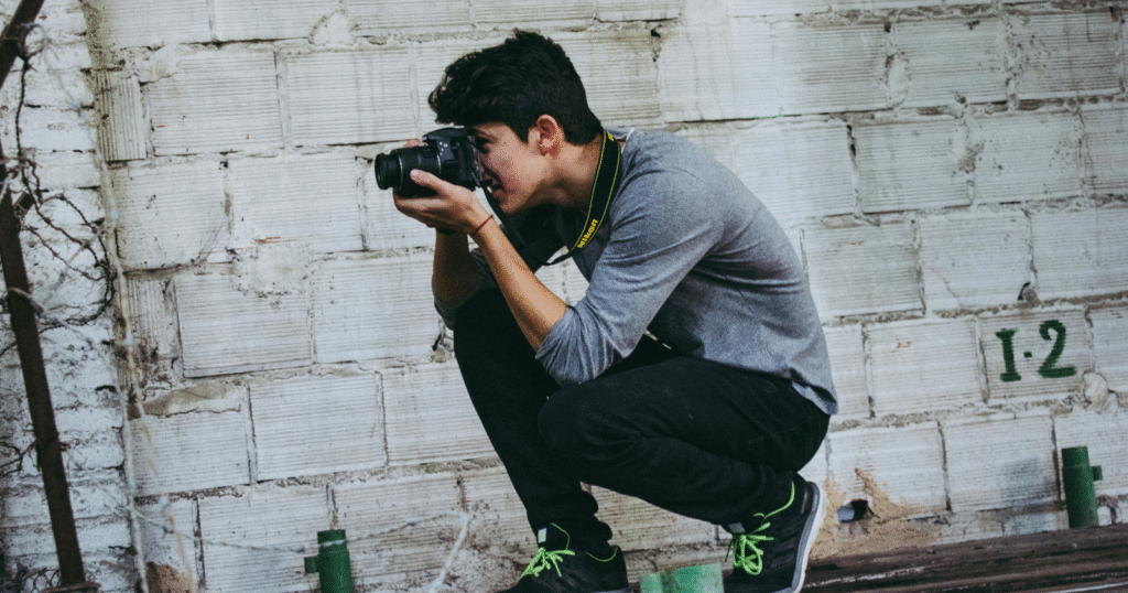 Photographer shooting in golden hour natural light for the best camera shoot with perfect brightness and warm tones.
